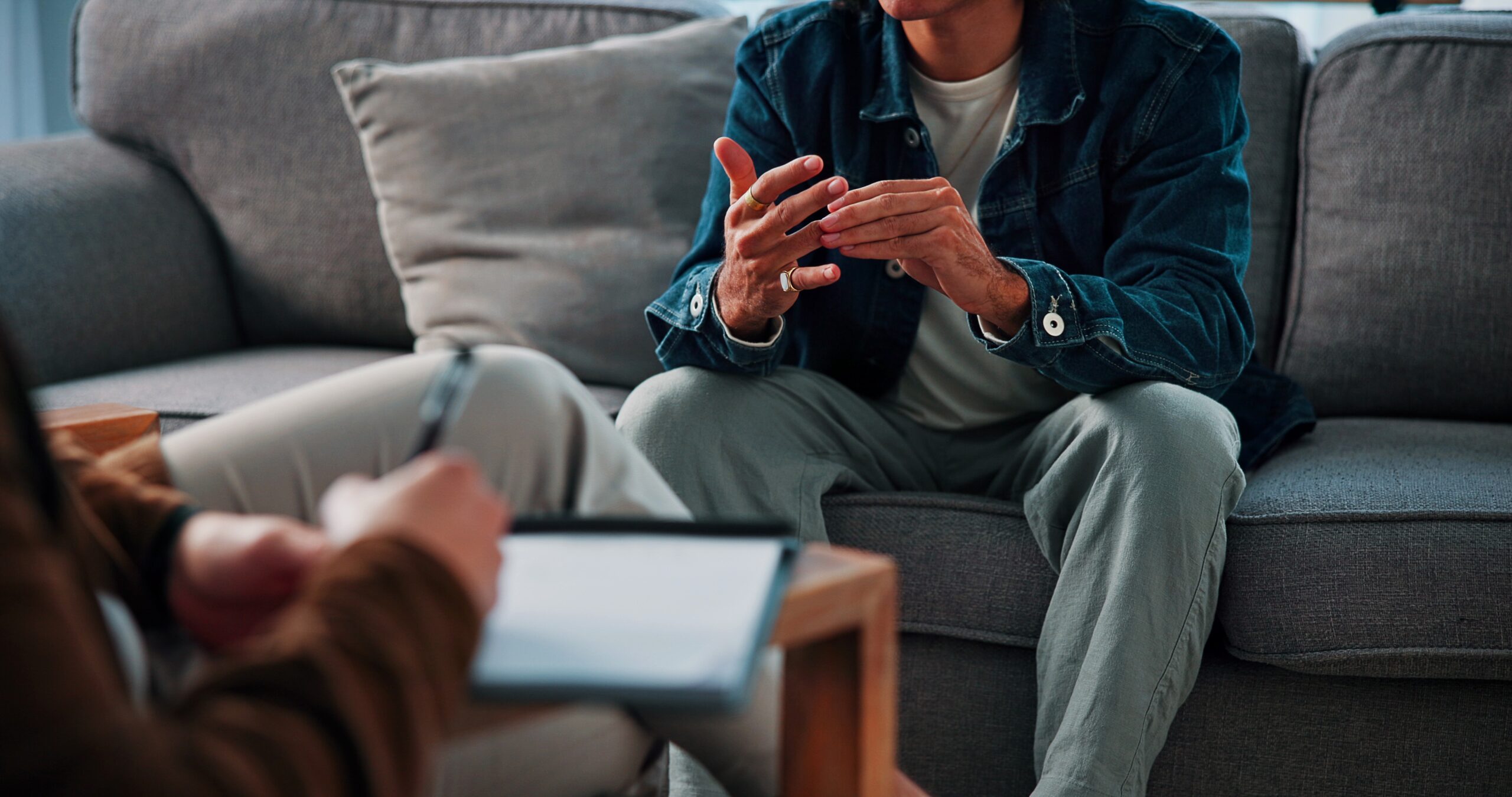Hands,,Stress,And,Man,On,Sofa,By,Psychologist,For,Emotional Psychotherapy